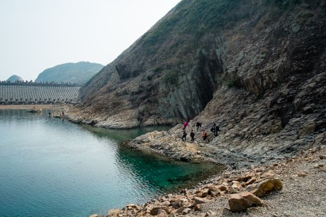 At the far side of the dam, one of the many sea caves in the area.
