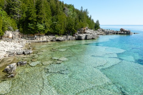 Crystal clear water lets you see the rock formations below.